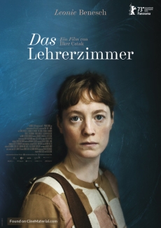 Movie poster for The Teachers' Lounge. Features a pale woman with red hair standing in front of blue chalkboard background.