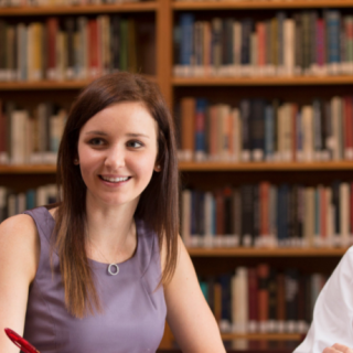 Environmental portrait of graduate Amazing Student Victoria Barker (2nd from left) working on a project with other second-year law students (L-R) Maria Kachniarz and Wheaton Webb in the Sohn International Law Library at ...